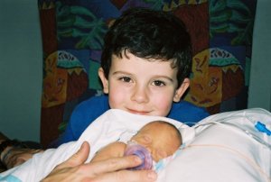 My son, when he was age 4, and his sister, Audrey Grace. She was six days old in this picture, the day before she went in for neurosurgery. She was a full term, 5lb, Trisomy 18 baby.