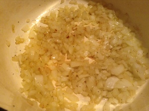 In large skillet, cook onion in hot oil till almost tender.