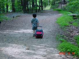 but my son walking away with his pack-pack.